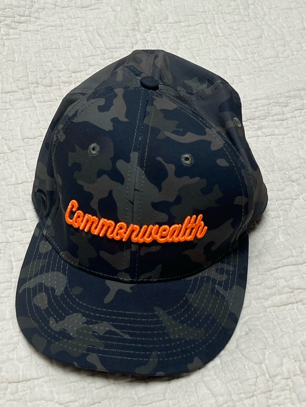 Commonwealth Men’s Dark Camo Cap with Orange Script